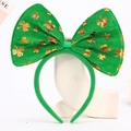 Detail of green velvet Saint Patrick's Day headband with gold clover print and big bow - Style 7 - Velvet Large Bow Headband with Gold Shamrock