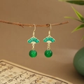 Detail of green fan-shaped earrings with bamboo leaf tassel hanging on a branch - Fan Emerald Bead (E6450)