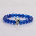 8mm blue faceted crystal beaded bracelet with silver crown charm on grey background - Blue Faceted Beads-Crown