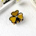 Small clover acetate hair claw in ginger yellow and black with iridescent rhinestone - Turmeric