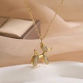 Elegante collana dorata con ciondolo a forma di cane palloncino e cristalli scintillanti - Cane palloncino dorato