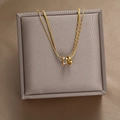 Goldene zweilagige Schlangenkette mit Zirkonia-besetztem Doppelring-Anhänger für Damen - Ineinandergreifende Ringe Halskette