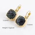 Detail shot of 13.5mm square green natural stone earrings with 14K gold-plated settings - African Pine Stone