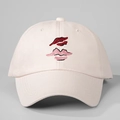 Macro detail of the red and pink lip embroidery on a light pink canvas baseball cap - One Size / Beige