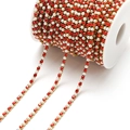 Golden DIY chain with red rhinestones and pearls on a white spool for jewelry making - 3mm Red