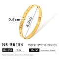 Macro view of gold stainless steel bangle with colorful crystals and star engraving - Four-Pointed Star Colorful Stone Style (NB-B6254)