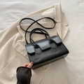Women's minimalist black leather shoulder bag with top handle and crossbody strap - Black