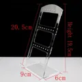 Three-tier transparent acrylic earring display stand showing stable trapezoid structure - Clear