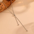 Detailed view of silver snake chain necklace with adjustable slider bead on warm background - Vertical Drawstring Necklace (C601)
