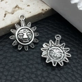 Silver vintage sun face pendant charms for DIY jewelry making on dark textured stone - Sun 8226 Silver 16mm