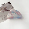Detail of a marble textured iridescent hair claw clip with glitter on a white table - 8cm Round Head / Starry Purple