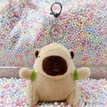 Brown Capybara plush keychain with green ribbon detail on soft short plush fur - Turtle Backpack Light Brown + Silver Clip