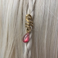 Detail of golden spiral dreadlock accessory with pink crystal charm on braided hair - Hot Pink Pendant