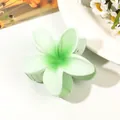 Detailed view of light green gradient plumeria flower hair claw clip with matte finish - Gradient Green