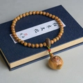 Green Sandalwood beaded bracelet featuring a miniature wooden teapot pendant and red bead - 8mm Round Beads Double Loop + Hand Pot Sachet Pendant