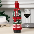 Knitted Christmas wine bottle cover with red pompom, snowflakes, and festive red-white pattern - Red Snowflake Style