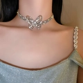 Macro view of a silver butterfly choker with multilayered sparkling crystal details - Necklace #18 - Eco-friendly - Silver