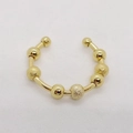 Detailansicht eines goldenen Anti-Angst-Rings mit drehbaren glatten und matten Perlen - Einheitsgröße / Sieben-Perlen-Stil / Gold
