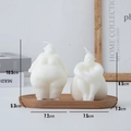 White body-shaped aesthetic candles in standing and sitting poses on a wood tray - Sitting Posture / White