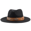 Close-up of black straw hat with brown leather band and silver studs in western style - Black