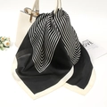 Close-up of elegant black and white striped silk scarf tied on a white leather handbag - 70-70cm / Black Striped (FJ014-1)