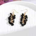 Detail of handmade black crystal stone drop earrings with gold chains on white ceramic - Gold Hook Style / Black Chip Stone