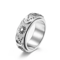 Silver spinner ring with sun, moon, and star relief on brushed stainless steel band - Size 6 / Steel