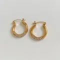 Elegant C-shaped open hoop earrings in gold finish with sparkling pavé rhinestones - Gold White Zirconia Style (KDE1999)
