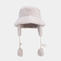 Detailed view of plush beige faux fur bucket hat with warm earflaps and fuzzy pompom ties - M (56-58cm) / Beige