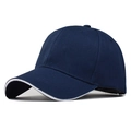 Detail view of the sandwich edge brim and navy blue polyester mesh on this baseball cap - Adjustable / Navy Blue