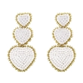 Detail of white and gold beaded earrings featuring a triple heart-shaped bohemian design - White