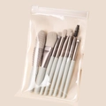8-teiliges hellblaues Make-up-Pinsel-Set mit silbernen Zwingen in mattierter Tasche - 8-teiliges Azurblaues Set