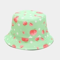 Dettaglio della texture del cappello alla pescatora verde chiaro con pesche e fiori - M / Verde Frutta