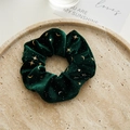 Dark green velvet scrunchie with gold stars and moon patterns on a stone tray - Velvet Scrunchie / Christmas Green Star