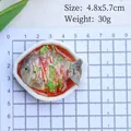 Close-up of 4.8x5.7cm braised fish food model magnet on a grid measurement mat - Steamed Fish (No Magnet)