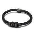 Men's black braided leather bracelet with two skull charms and magnetic buckle - 19cm / Black