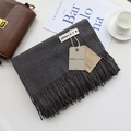 Detail of dark grey cashmere-style scarf with long tassels and elegant brand tag - Dark Gray / 200cm