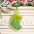 Green knit Christmas stocking with gold glitter letter T and plush cuff detail - Letter T