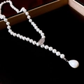 Vintage style butterfly pearl necklace with drop pendant on a black jewelry box - White Silver Leaf Teardrop Pearl Necklace
