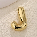 Macro detail of high-polish gold bubble letter J pendant with a glossy metallic finish - Letter J