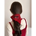 Red plaid hair tie with black bow and gold heart pendant on low ponytail - Red Knit Heart Charm
