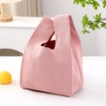 Pink minimalist knitted handbag on white table with fresh fruit and plant decor - Light Pink