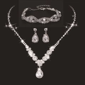 Macro view of bridal jewelry set with sparkling pear-shaped rhinestones on black background - 501+746 Set / Silver