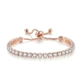 Close-up of rose gold tennis bracelet with clear crystals and adjustable slider clasp - Rose Gold White Rhinestones