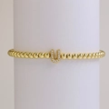 Elegant 18k gold plated beaded elastic bracelet with a micro-paved letter U charm - Letter U
