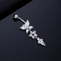Macro shot of silver butterfly navel ring with crystal floral tassels on black reflective surface - Butterfly Pentagram Silver