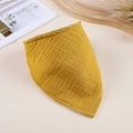 Detail of yellow double-layer muslin baby bandana bib with textured cotton fabric on wood - Ginger Yellow
