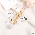 Elegant gold keychain with pearls and black enamel flower pendant, 10cm long design - Charm / K3044 Crystal Ball + Clothes Pendant