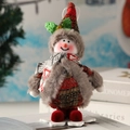 Detail of Christmas snowman plush with red plaid fabric, sequins, and golden bell - Snowman