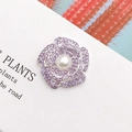 Detailed view of a purple rhinestone flower brooch with a central pearl on a white card - Alloy / Silver Base Purple (Pearl Flower)